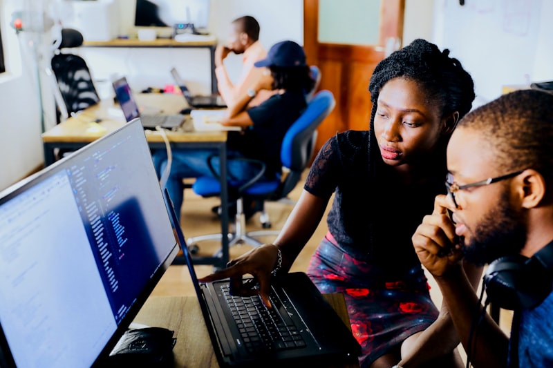 Modern coworking space with digital nomads working on laptops