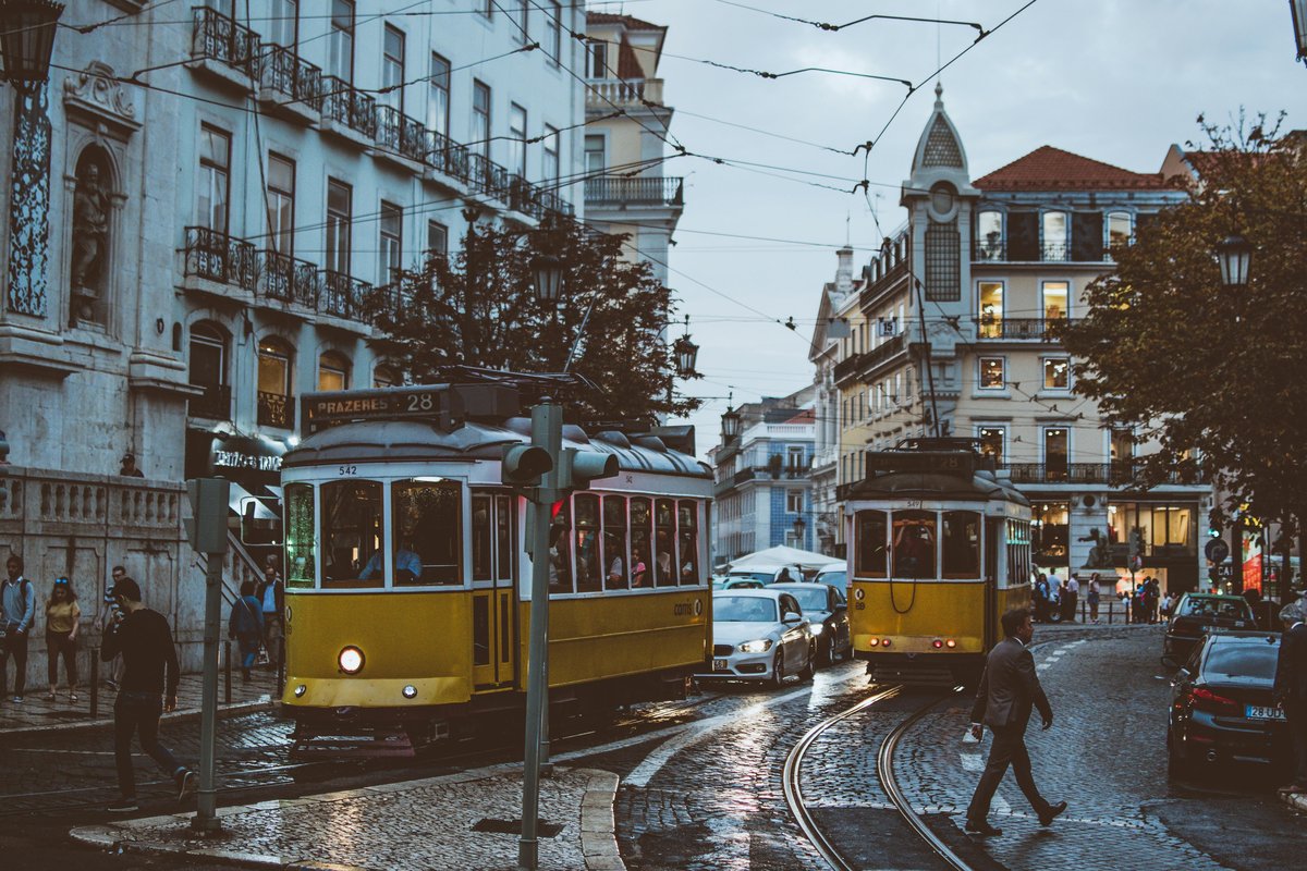 Colorful Lisbon street with traditional tram